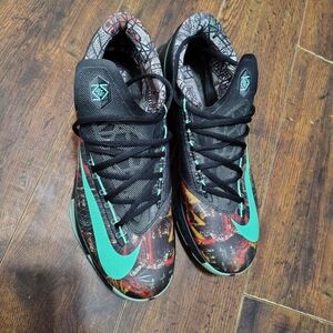 Nike Athletic Shoes with Black and Teal Accents